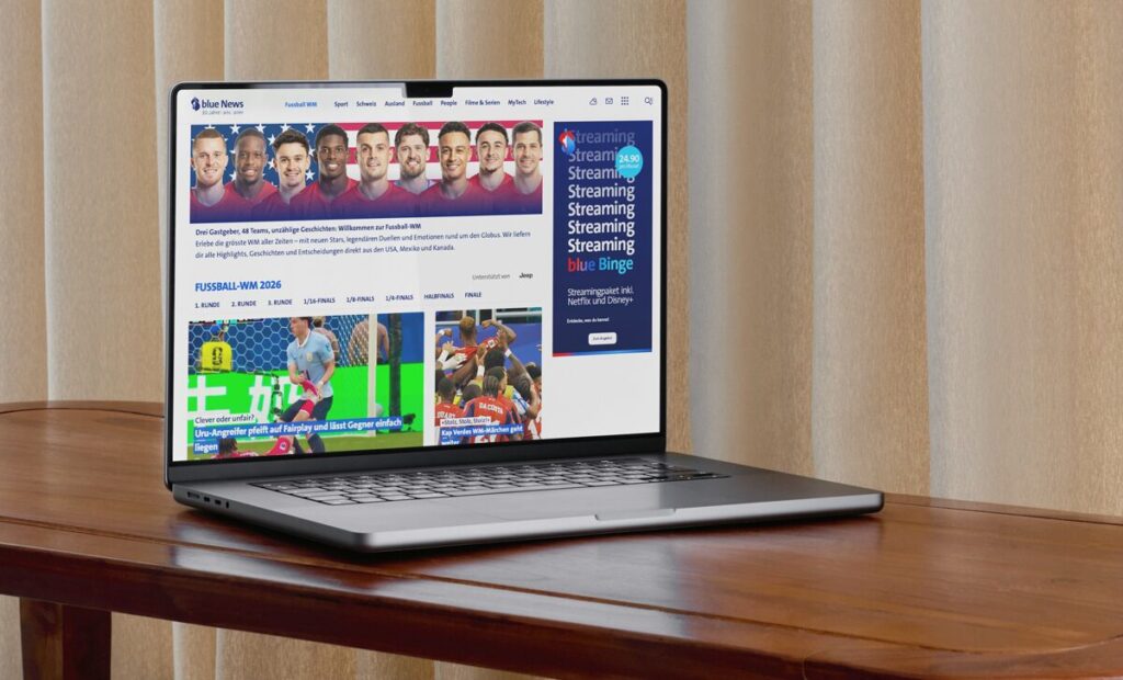 Blue News Website mit neuer Navigation und Werbeformaten auf einem Laptop dargestellt.